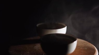 Brewing puerh tea. Traditional chinese tea ceremony. Tea pouring to teapot on a tea tray