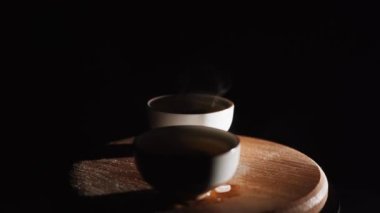 Brewing puerh tea. Traditional chinese tea ceremony. Tea pouring to teapot on a tea tray