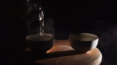 Brewing puerh tea. Traditional chinese tea ceremony. Tea pouring to teapot on a tea tray