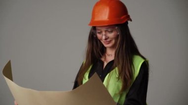 Construction worker. Woman engineer on white background in studio