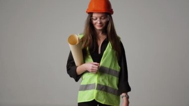 Construction worker. Woman engineer on white background in studio