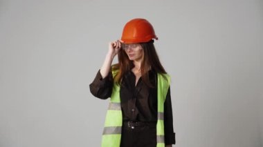 Construction worker. Woman engineer on white background in studio