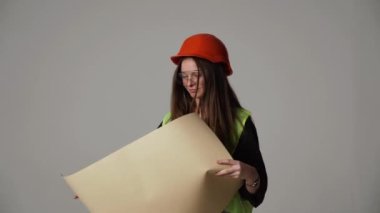 Construction worker. Woman engineer on white background in studio