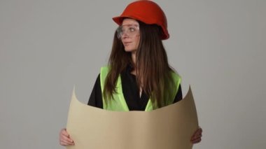 Construction worker. Woman engineer on white background in studio