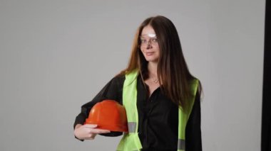 Construction worker. Woman engineer on white background in studio