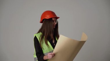 Construction worker. Woman engineer on white background in studio