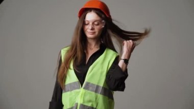 Construction worker. Woman engineer on white background in studio