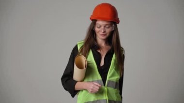 Construction worker. Woman engineer on white background in studio