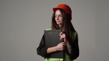 Construction worker. Woman engineer on white background in studio