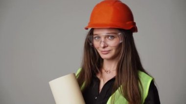 Construction worker. Woman engineer on white background in studio