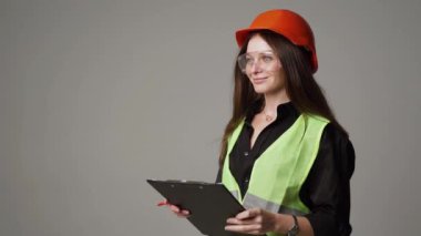 Construction worker. Woman engineer on white background in studio