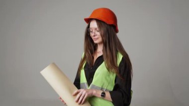Construction worker. Woman engineer on white background in studio
