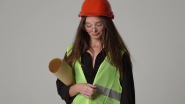 Construction worker. Woman engineer on white background in studio