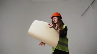 Construction worker. Woman engineer on white background in studio