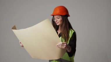 Construction worker. Woman engineer on white background in studio
