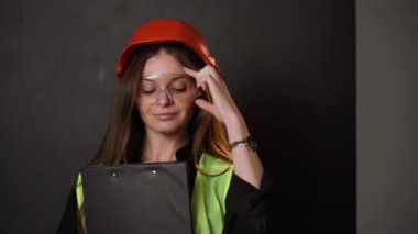 Construction worker. Woman engineer on white background in studio