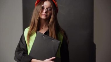 Construction worker. Woman engineer on white background in studio