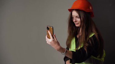 Construction worker. Woman engineer on white background in studio