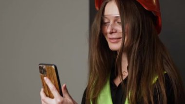 Construction worker. Woman engineer on white background in studio