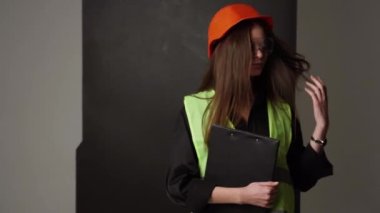 Construction worker. Woman engineer on white background in studio