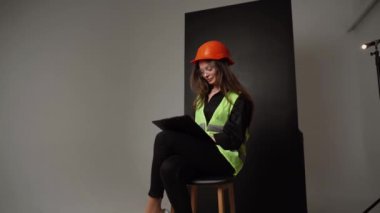Construction worker. Woman engineer on white background in studio