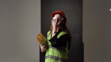 Construction worker. Woman engineer on white background in studio