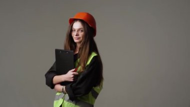 Construction worker. Woman engineer on white background in studio