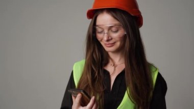 woman engineer holding green screen phone 4k