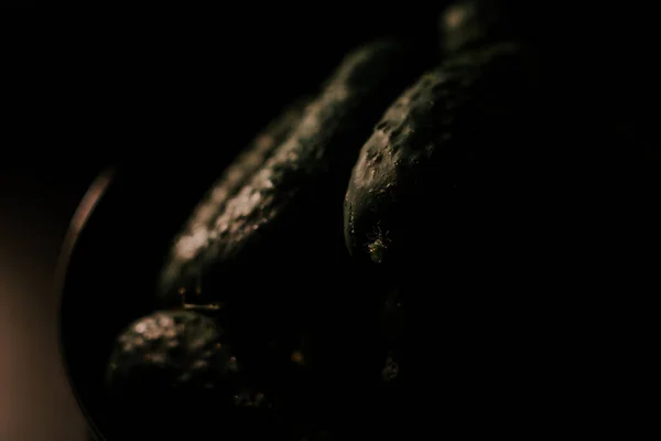 stock image Cucumbers on a black background.Close up