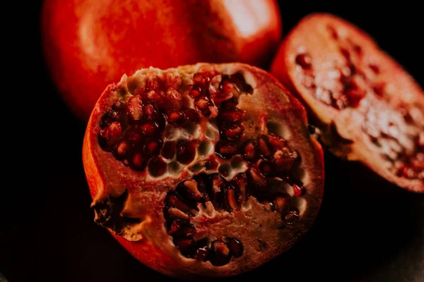 stock image Pomegranate fruit. Fresh and ripe Pomegranates rotating over black Background. Organic Bio fruits closeup. Diet, dieting concept.