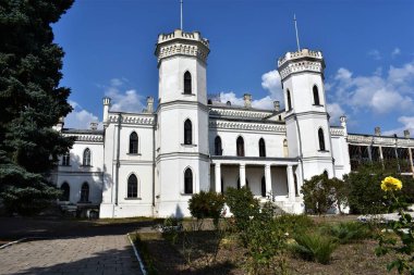 An ancient European white stone palace in the Neo-Gothic style