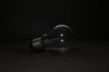 An unlit electric lamp on top of a sofa