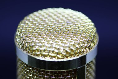 Condenser microphone with gold accents