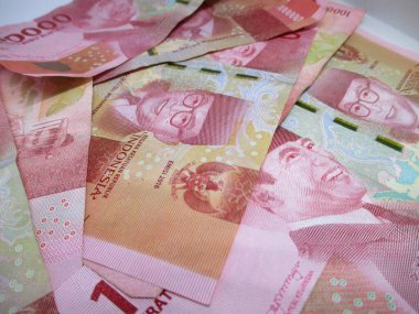 pile of Indonesian rupiah banknotes with the theme of the financial crisis