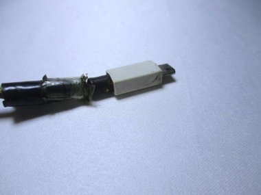 photo of a cable that was about to be peeled off but in black isolation by the owner