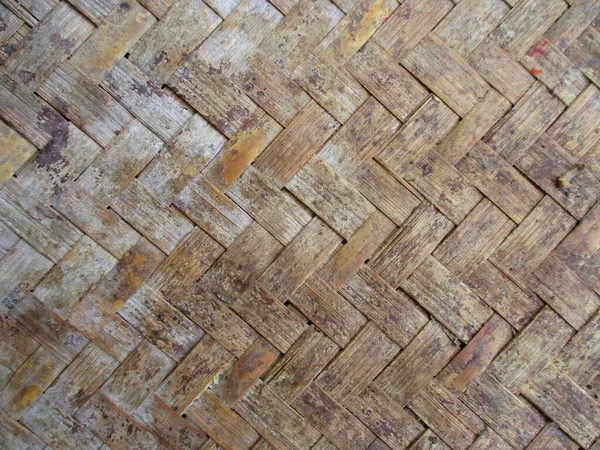 a photo background with a woven bamboo design