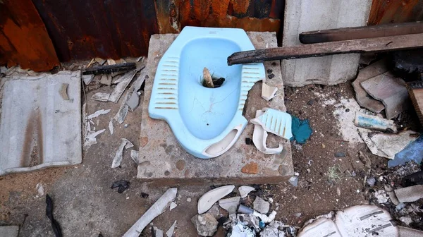 stock image squat toilet from indonesia which has been destroyed in an accident and not used