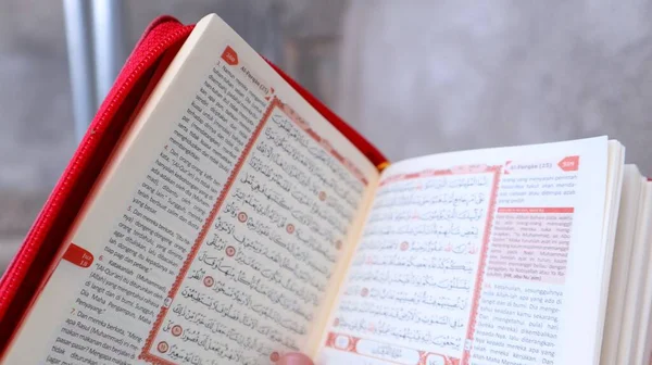 stock image the opened holy quran shows the verses of the holy quran