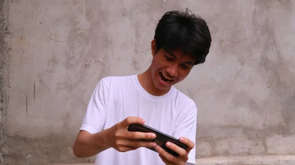 Asian Man Using Smartphone Playing Game — Stock Photo, Image