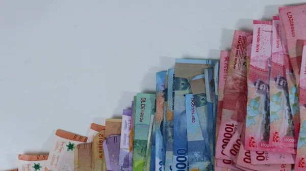 stack of various Indonesian money, inflation investment, shopping on white background