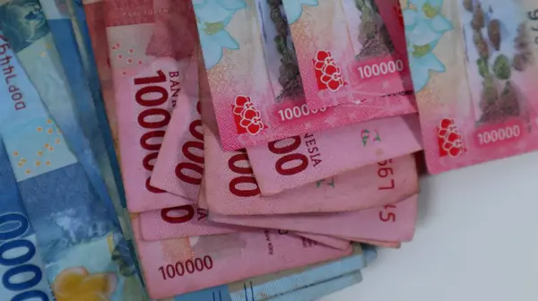 stack of various Indonesian money, inflation investment, shopping on white background