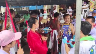 Phang Nga, Thailand - October 15, 2022: Shaman Cheek Piercing at Vegetarian Festival in Thailand in 4K High Res