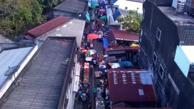 Drone aerial of Friday Market in Thai Muang, Thailand. High quality 4k footage. A wonderful mix of fresh fruists and vegetables.