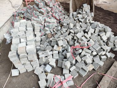 pile of cobblestone ready to be installed. cobblestone with a size of 10 cm x 10 cm x 5 cm.
