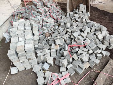 pile of cobblestone ready to be installed. cobblestone with a size of 10 cm x 10 cm x 5 cm.