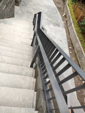 outdoor area stair railing, made of iron with a modern minimalist model.