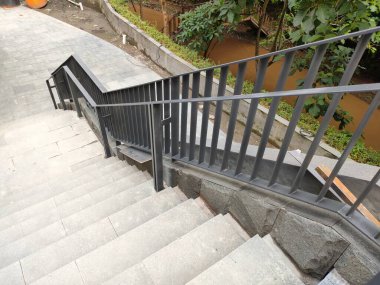 outdoor area stair railing, made of iron with a modern minimalist model.