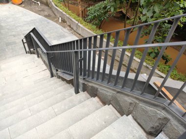 outdoor area stair railing, made of iron with a modern minimalist model.