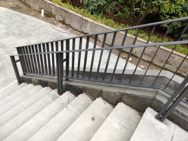 outdoor area stair railing, made of iron with a modern minimalist model.