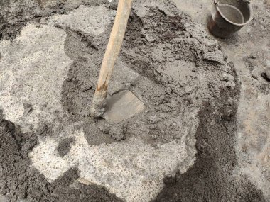 mixture of cement, sand and water, mixed manually using a hoe. ready for plastering the walls of the building.